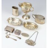 An Art Deco oval silver pepper Birmingham 1936, a trophy cup, 2 dishes and minor items, 258 grams