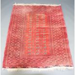 A red and blue ground Afghan rug with 51 octagons to the centre 206cm x 159cm Faded in places
