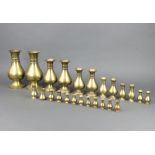 Jones and Willis, a pair of club shaped brass vases 23cm h together with 10 other graduated pairs