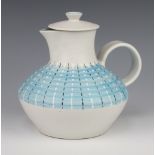 A vintage Denby jug with geometric decoration and non matching cover 19cm