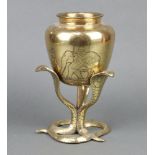A Benares polished brass vase supported by 3 cobras 25cm x 14cm