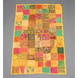 An Indian yellow and green ground patchwork wall hanging 147cm x 98cm