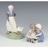 A Royal Copenhagen figure of a goose girl 528 19cm and a ditto of a seated girl and boy reading a