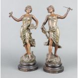 After E R Richard, a pair of Art Nouveau spelter figures on socle bases - "Recompense and