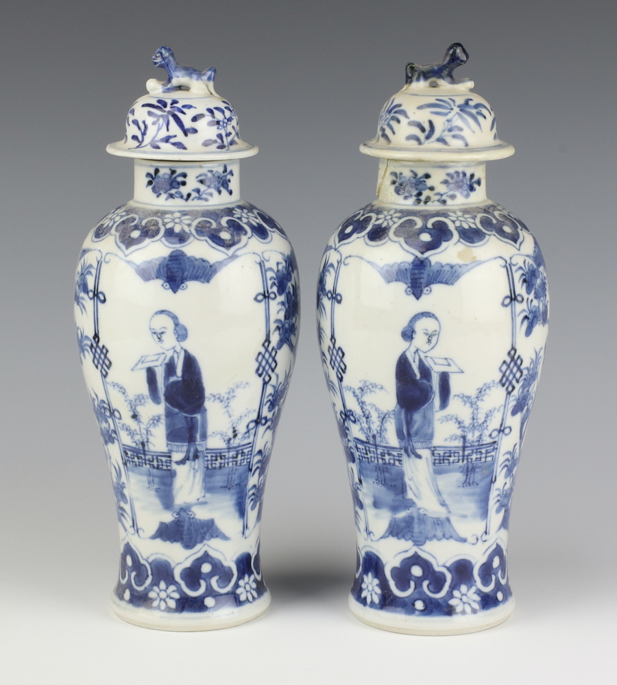 A pair of Chinese 19th Century blue and white oviform vases decorated with figures on a balcony with - Image 3 of 6