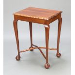 An Edwardian rectangular Chippendale style mahogany occasional table raised on cabriole, ball and