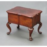 An Eastern hardwood sewing box of serpentine outline with hinged lid, interior fitted a tray, raised