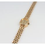 A lady's 9ct yellow gold Churchill quartz wristwatch and bracelet, 16.3 grams gross