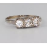 A white metal 3 stone diamond ring, approx. 1ct, size P, 3.3 grams
