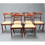 A set of 6 19th Century mahogany bar back dining chairs with carved mid rails and upholstered drop