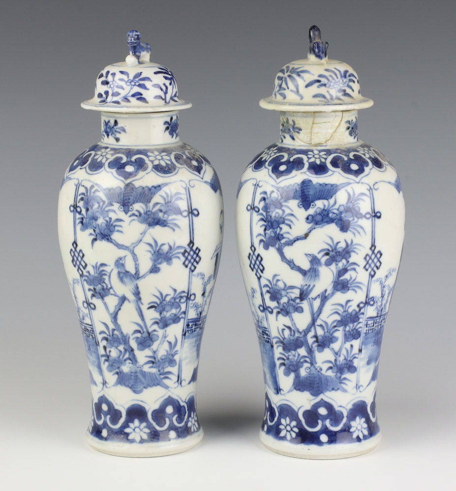 A pair of Chinese 19th Century blue and white oviform vases decorated with figures on a balcony with - Image 2 of 6