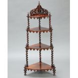 A Victorian rosewood graduated 4 tier corner what-not, the back with pierced gallery, raised on