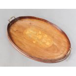 An Edwardian oval inlaid mahogany twin handled tea tray 3cm x 61cm w x 39cm d Warped, split to