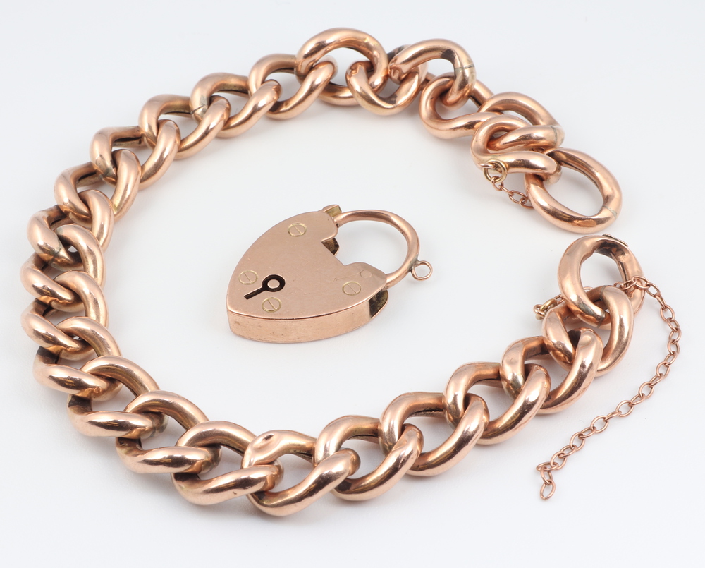 A 9ct yellow gold hollow link bracelet and padlock, 20cm 16 grams