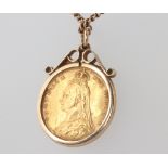 A Victorian half sovereign 1892, contained in a yellow metal mount and chain 48cm, 5 grams
