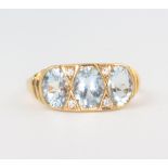 A yellow metal 15ct Victorian style aquamarine and diamond ring, the aquamarine 2.20ct, the