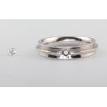 A white metal wedding band size L, 4.3 grams, together with a loose diamond 0.10ct