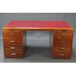 Waring and Gillow, an Art Deco mahogany desk with red inset writing surface fitted a brushing