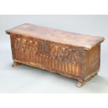 A 16th and later Century Spanish Gothic carved fruitwood coffer with iron hinged lid and shaped iron