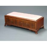 An ottoman formed from the base of an Edwardian wardrobe with upholstered drop in seat, the base