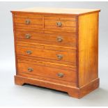 An Edwardian bleached walnut chest of 2 short and 3 long drawers with brass drop handles, raised