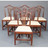 A set of 6 19th Century Hepplewhite style camel back dining chairs with pierced vase shaped slat