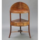 A Georgian mahogany corner wash stand with raised back and undertier, fitted a drawer, raised on