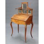 A Victorian inlaid rosewood bonheur du jour, the raised back fitted a mirror flanked by shelves, the