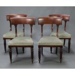 A set of 4 William IV mahogany bar back dining chairs with overstuffed seats, raised on turned and