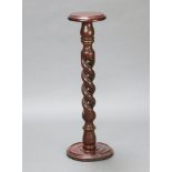 A Victorian style circular pedestal raised on a pierced spiral turned column, circular base 91cm h x