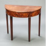 A 19th Century mahogany demi-lune tea table raised on square supports 73cm h x 84cm w x 41cm d