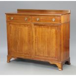 An Edwardian inlaid mahogany cabinet with raised back fitted 2 drawers above a pair of panelled