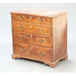 An 18th/19th Century oak chest of 4 long drawers with steel locks and brass swan neck drop