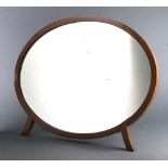 An Art Deco oval bevelled plate dressing table mirror contained in a walnut frame 44cm x 57cm x 20cm