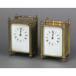A pair of 19th Century French 8 day carriage timepieces with 7cm dials, contained in gilt metal