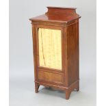 An Edwardian mahogany music cabinet with raised back, fitted shelves enclosed by a glazed panelled