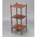 A Victorian rosewood 3 tier what-not of serpentine outline, raised on turned supports 86cm h x