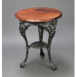 A Victorian style circular pierced cast iron and mahogany pub table, decorated figures of
