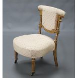 A 19th Century gilt painted prie-dieu chair with turned and fluted columns to the side, raised on