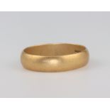 An 18ct yellow gold wedding band size W 1/2, 6.8 grams