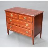 An Edwardian inlaid mahogany chest of 2 short and 2 long drawers with replacement brass handles,
