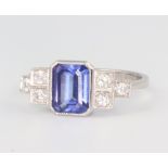 A yellow metal oval tanzanite and diamond cluster ring, the centre stone 0.25ct, the brilliant cut