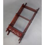 A Chippendale style mahogany 3 tier hanging wall shelf with pierced panels to the sides, blind