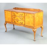 A 1950's Queen Anne style quarter veneered bow front sideboard with raised back, fitted 3 drawers,