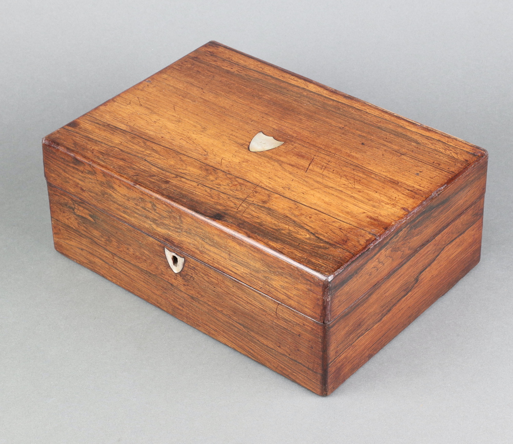 A Victorian rosewood trinket box, the top inlaid a mother of pearl shield shaped panel and