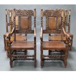 A set of 6 Tudor style carved oak dining chairs with solid seats and backs comprising 2 carvers