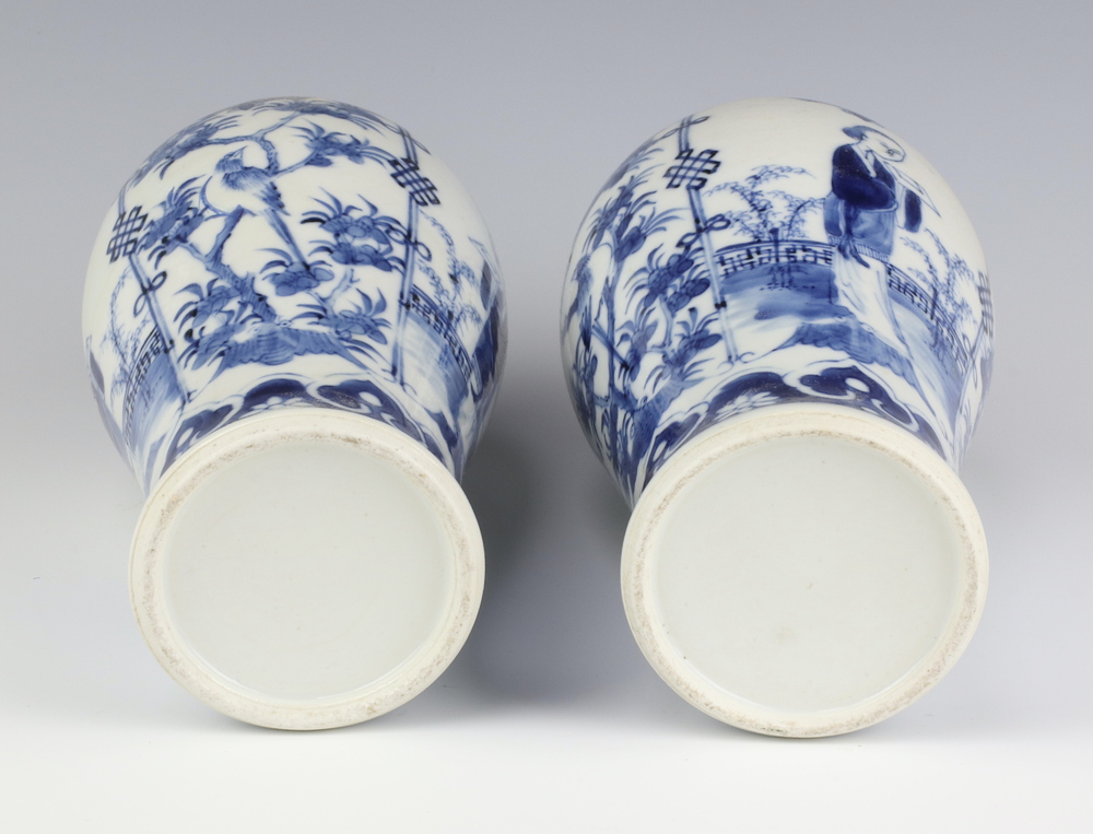 A pair of Chinese 19th Century blue and white oviform vases decorated with figures on a balcony with - Image 6 of 6