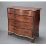 A Georgian mahogany chest of serpentine outline, gadrooned decoration and canted corners, fitted 4