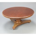 A William IV circular mahogany breakfast table raised on chamfered column and triform base (cut down