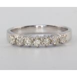 An 18ct white gold 7 stone diamond ring, approx. 0.5ct, 3.7 grams, size P, with WGI certificate